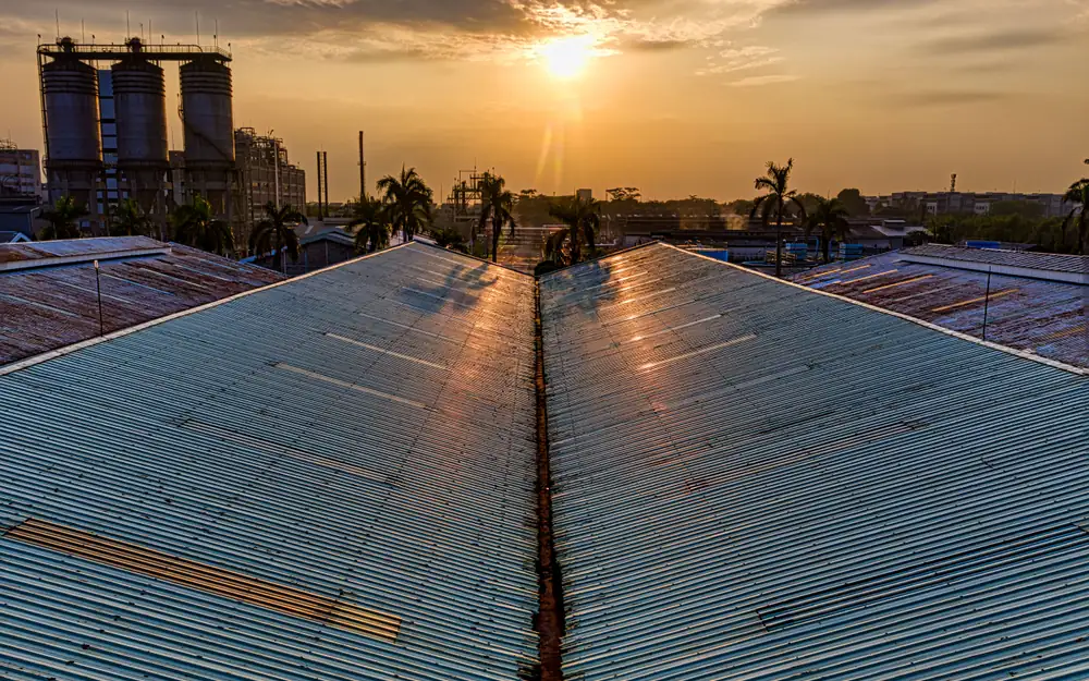 Expansive metal roofs catching the warm light at sunset